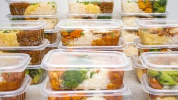 Multiple containers of prepared meals with rice and vegetables for easy meal management.