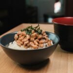 Close-up of a traditional Japanese breakfast bowl with natto and rice, capturing cultural essence.