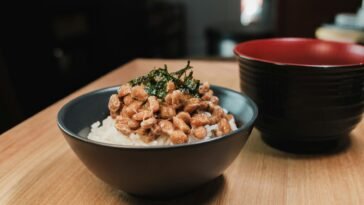 Close-up of a traditional Japanese breakfast bowl with natto and rice, capturing cultural essence.