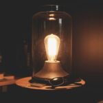 Warm glow of a vintage Edison bulb in a glass dome, creating a cozy ambiance.