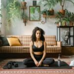 Serene yoga session at home with plants creating a calming ambiance.