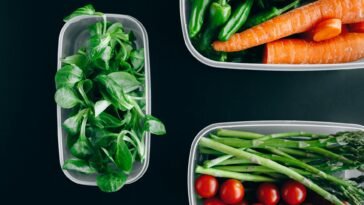 Organic vegetables displayed in plastic containers for a healthy diet.