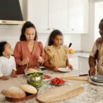 Family cooking together in a bright kitchen, enjoying quality time and preparing a delicious meal.