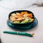 Delicious and nutritious grilled chicken bowl with quinoa and fresh vegetables for a balanced meal.